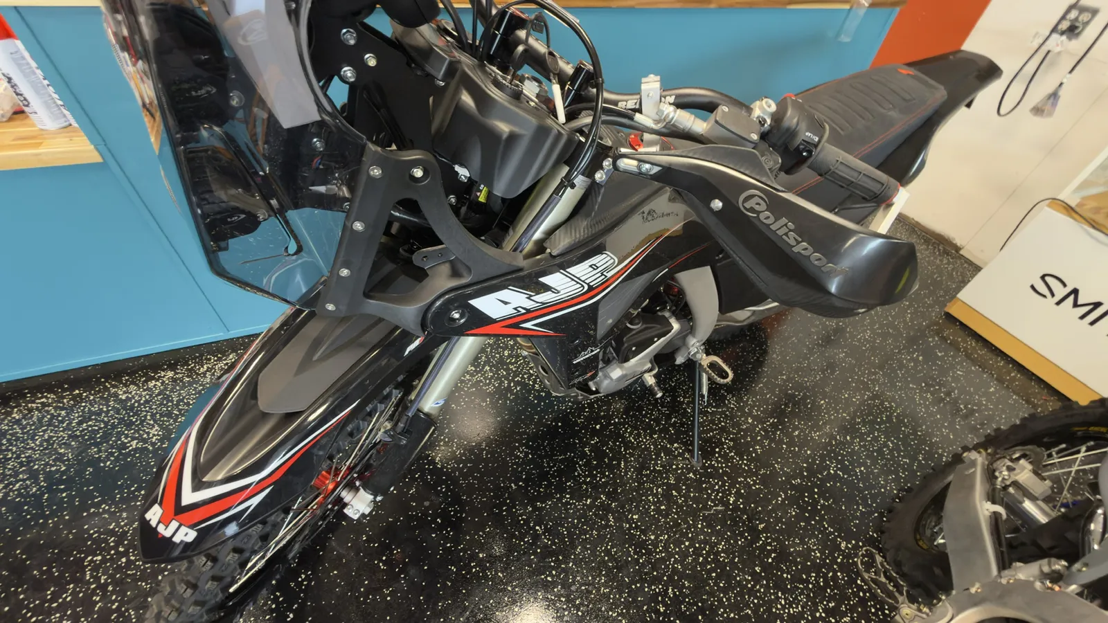 Black AJP PR7 at Salto Moto: Bars, guards and nav tower