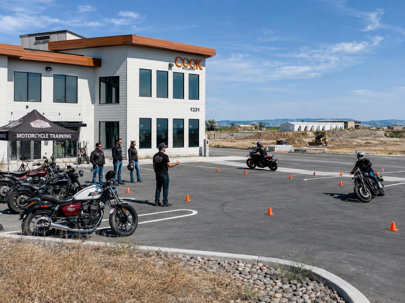 Riders working a cone course on the Salto lot while an instructor coaches