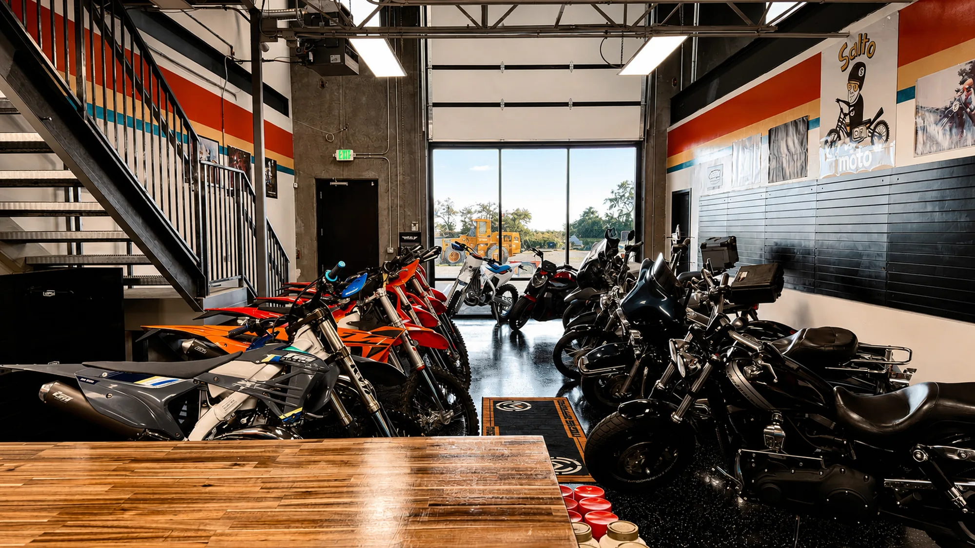 The Salto Moto showroom floor with the bay door open